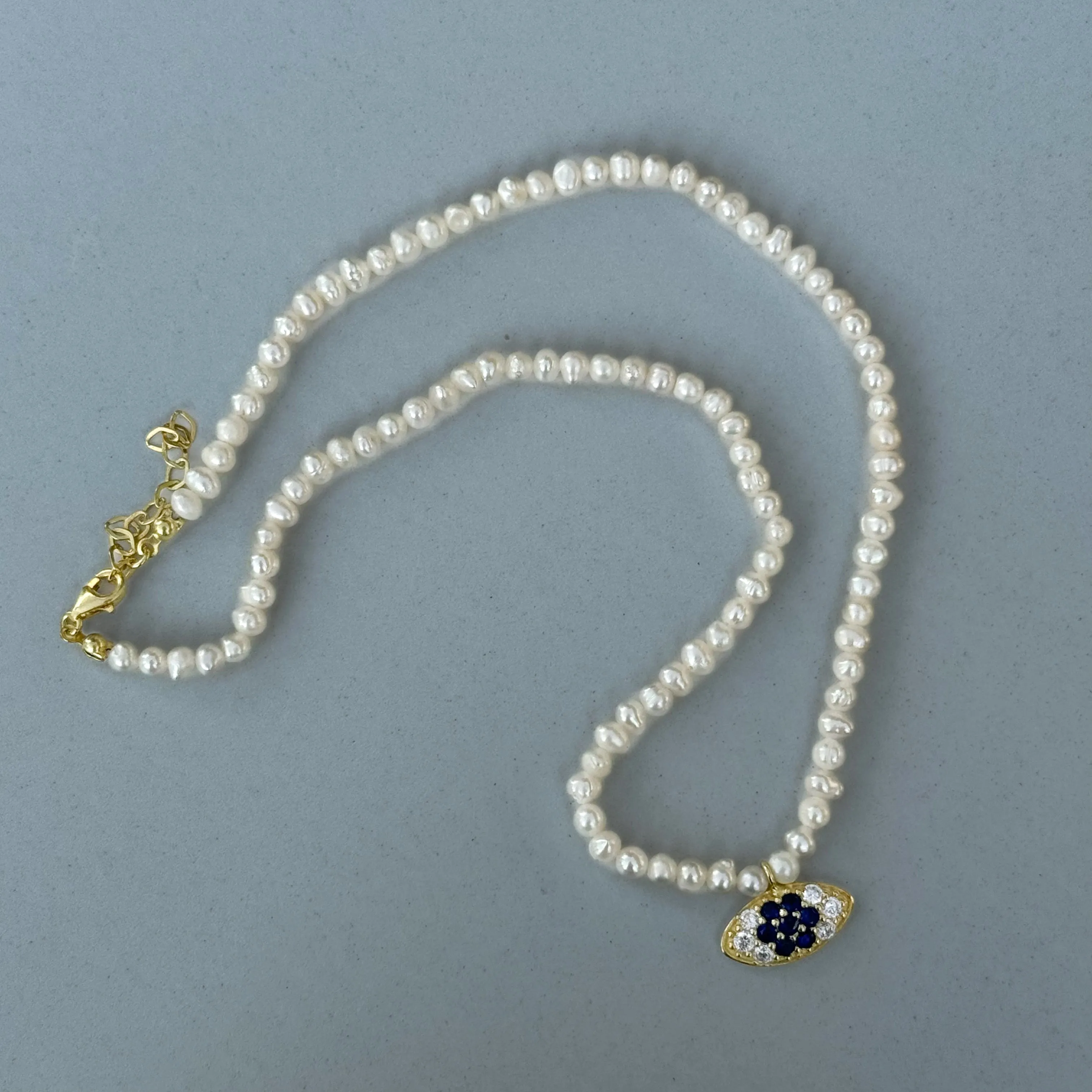 Small pearl beaded navy eye necklace